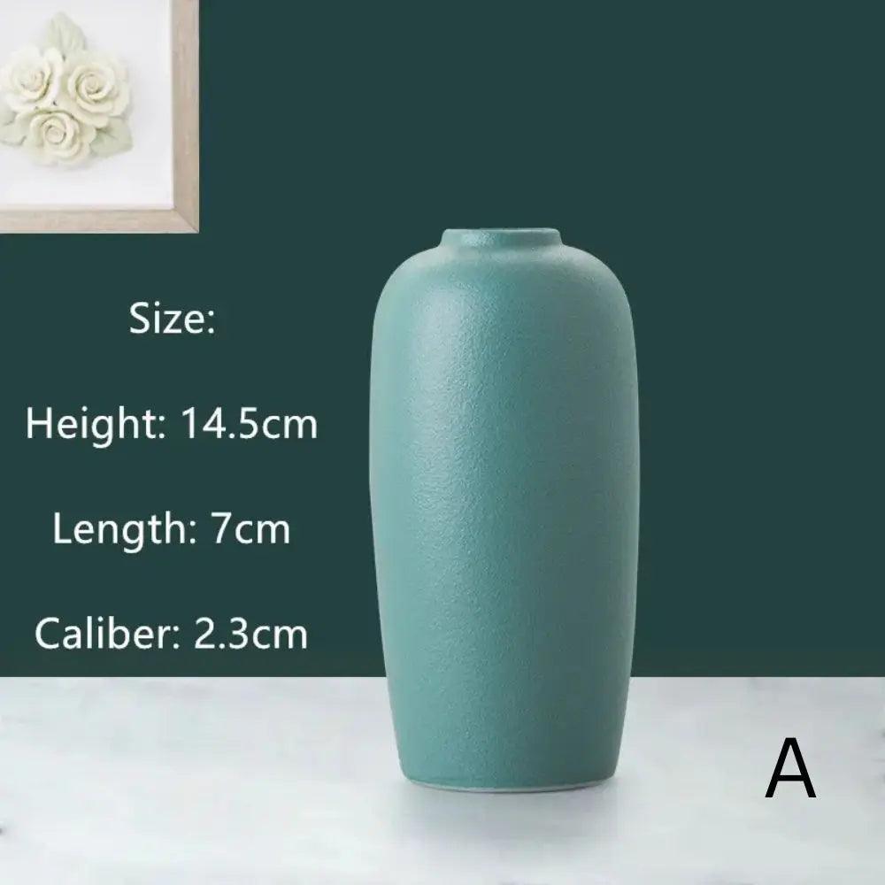 A textured teal vase displayed with dimensions: 14.5cm height, 7cm length, and 2.3cm opening, against a dark green background.