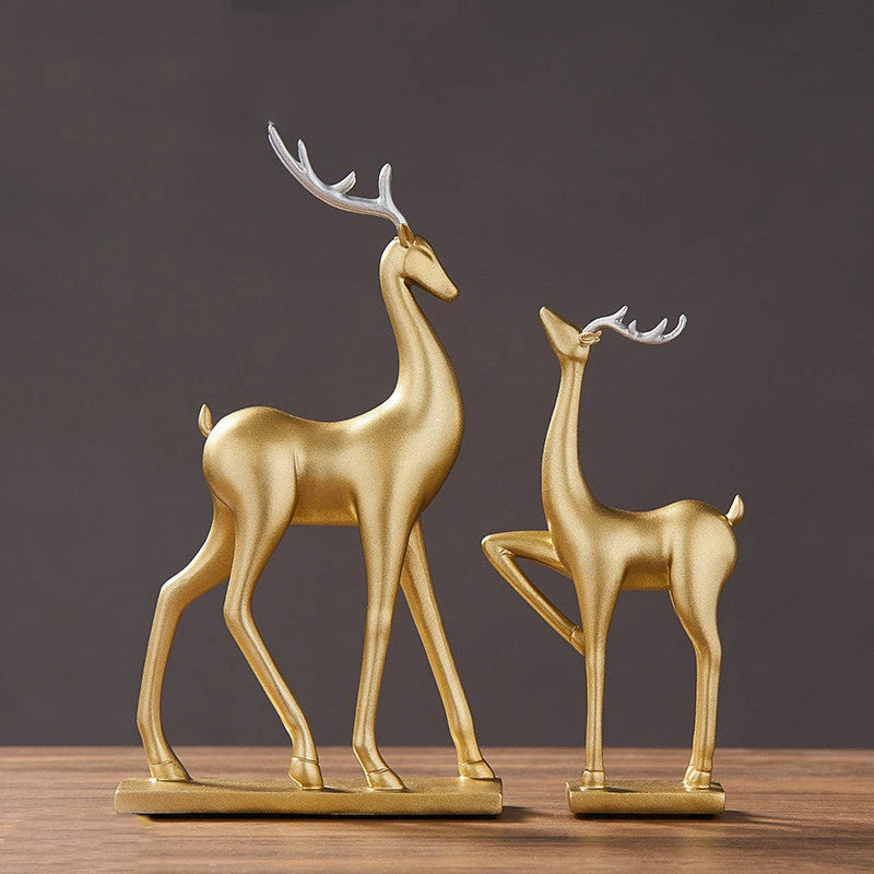 Elegant gold resin deer sculptures in modern Nordic style, displayed as a decorative tabletop ornament set.