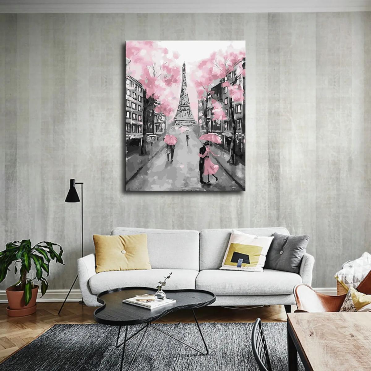 A romantic watercolor scene of Paris features the Eiffel Tower amidst pink blossom trees, with couples under pink umbrellas.