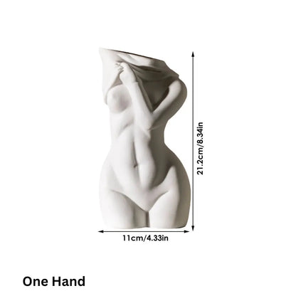 A sculptural vase representation of a female torso draped in fabric, highlighting curves and an artistic interpretation of the human form.